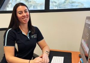 Dr Emily Laffin seated at her desk