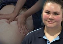 Image of Lucy O'Brien with faded back massage graphic behind her