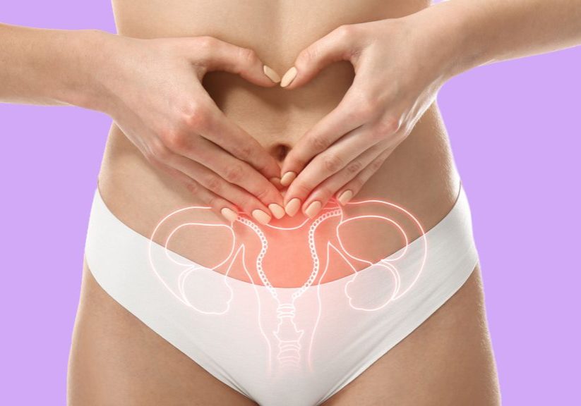 Women making a heart symbol over her belly button with a diagram of her pelvic region etched across the image
