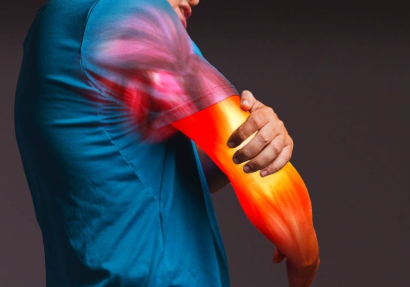 person holding painful elbow